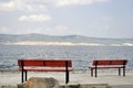 Lonely two benchs beside the sea Royalty Free Stock Photo