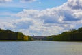 A lonely view of Versailles park, France. The geometric combination of green trees, grass areas and Grand Canal Royalty Free Stock Photo