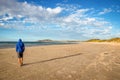 Lonely walk on the beach Royalty Free Stock Photo
