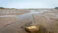 Lonely walker at low tide in Parc National du Bic Royalty Free Stock Photo