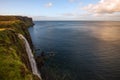 Lonely water fall with cliff and Lush grass in Isle of Skye, Scotland.