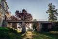Lonely wedding couple stands under the stone bridge Royalty Free Stock Photo