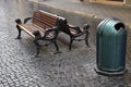 Lonely wet stone streets and benches after rain Royalty Free Stock Photo