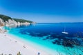 Lonely white catamaran yacht drift in clear blue Caribbean like sea water. Tourists leisure activity on the beach with Royalty Free Stock Photo