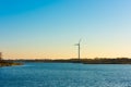 A lonely wind turbine by the sea Royalty Free Stock Photo
