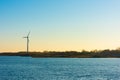 A lonely wind turbine by the sea Royalty Free Stock Photo