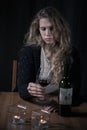 Lonely woman addicted to alcohol