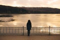 Lonely woman alone in winter at sunset Royalty Free Stock Photo