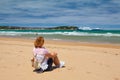 Lonely woman on the beach and Brittany Ferries near the coast of Royalty Free Stock Photo