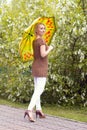 The lonely woman in a beautiful knitted jacket. The beautiful woman on walk. Fashionable clothes. Royalty Free Stock Photo