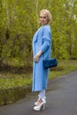 The lonely woman in a beautiful knitted jacket. The beautiful woman on walk. Fashionable clothes. Royalty Free Stock Photo