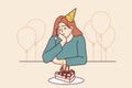 Lonely woman at birthday party with cake and balloons is sad due to lack of friends