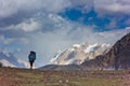 Lonely woman hiking in the mountains