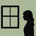 lonely woman looking out the window silhouette Royalty Free Stock Photo