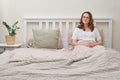 A lonely woman is lying alone in an bed. Female bedroom with an empty pillow Royalty Free Stock Photo