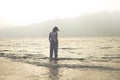 Lonely woman meditates in front of a spectacular view