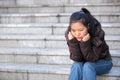 Lonely woman sitting on the stairs Royalty Free Stock Photo