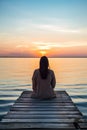 lonely woman sitting on wooden pier at lake or sea, serenity and calmness, solitude concept