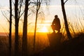 Lonely woman at sunrise. Solitude concept, alone in forest Royalty Free Stock Photo