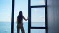 Lonely woman thinking problems at panorama window. Upset businesswoman crying Royalty Free Stock Photo