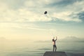 Lonely woman tries to control her balloon that wants to escape to freedom