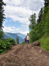 Lonely woman walking along a footpath Royalty Free Stock Photo