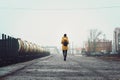 Lonely woman walks on a railway platform