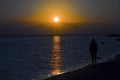 Lonely woman watching sunset