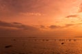 Lonely wooden fisherman boat with the seagulls when sunset / sunrise on the sea Royalty Free Stock Photo