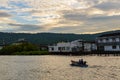 A lonely wooden fishing boat returns to the village after night catching at dawn Royalty Free Stock Photo