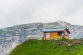 Lonely wooden house on top of a mountain Royalty Free Stock Photo