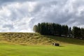 Lonely wooden hut on alpine meadows Royalty Free Stock Photo