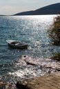 Lonely wooden white boat is in the Bay Royalty Free Stock Photo