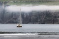 Lonely yacht near Tjornuvik coast on Streymoy Island Royalty Free Stock Photo