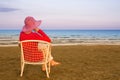 Lonely young woman near the ocean