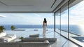 Lonely young woman stands at luxury living room and looks at sea behind window, person and stunning amazing view from apartment. Royalty Free Stock Photo