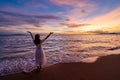 Lonely young woman walking and enjoying beautiful Sunset on the tranquil beach, Travel on summer vacation concept Royalty Free Stock Photo