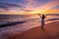 Lonely young woman walking and enjoying beautiful Sunset on the tranquil beach, Travel on summer vacation concept Royalty Free Stock Photo