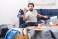 loner throwing dirty sock into basket with laundry