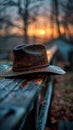 Lonesome Cowboy Hat Resting on a Barn Beam at Dusk The hat blurs with the wood Royalty Free Stock Photo