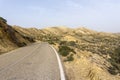 Lonesome highway leading into the Tabernas Desert in Andalusia Royalty Free Stock Photo