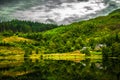 Lonesome House At Calm And Smooth Lake In Scotland