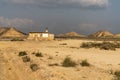 Lonesome hunting cabin in wild and secluded desert grasslands