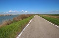Lonesome road in the region Delta del Po, a natural paradise. Italy. Royalty Free Stock Photo