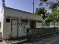 a long-abandoned public bathroom with vandalism paint