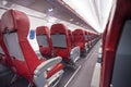 Long aisle with rows of sits in airplane economy Royalty Free Stock Photo
