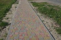 Long alley of colored paving slabs