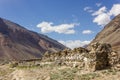 A long ancient wall of Tibetan Buddhist mani stones