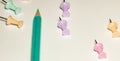 Long background with pencil and push pins in delicate colors Royalty Free Stock Photo