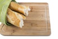 Long baguette broken into pieces on white background Royalty Free Stock Photo